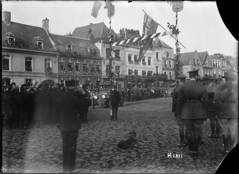 Street scene during the arrival of French President Raymond Poincare at Le Quesnoy, France. 10 November 1918.Photographed by Captain H. A Sanders. H1311. NZ RSA Collection. Alexander Turnbull Library, Wellington, New Zealand